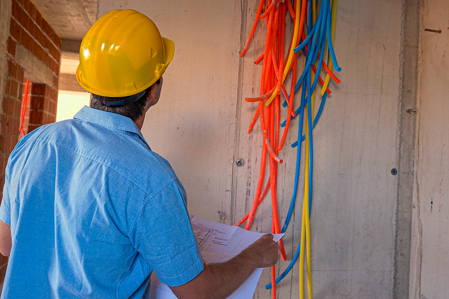 man looking at tubes n commercial building corry pa